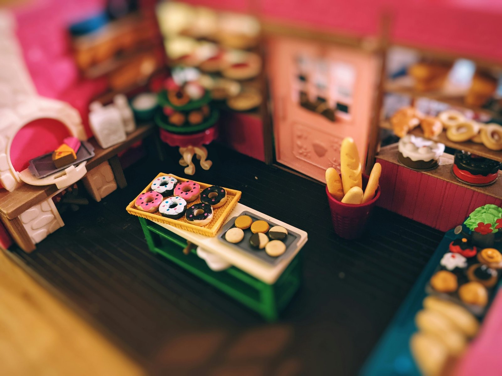 Miniature bakery toy set with tiny pastries and baked goods – detailed and realistic collectible scene.
